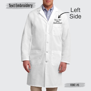 May include: A white lab coat with a button-up front, two front pockets, and long sleeves. The text "Text Embroidery" is at the top left. The text "Your Text Here Embroidered" is on the left side of the coat. The text "Left Side" is on the right side of the coat. The text "FONT: #5" is at the bottom right.
