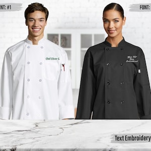 May include: A white chef coat with the embroidered text Chef Oliver G. and a black chef coat with the embroidered text Your Text Here Embroidered. Both coats feature long sleeves, a double-breasted front with buttons, and a small pocket on the sleeve.