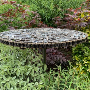 Welded coffee table or wall display. Made to order and if used as a table would have an similar industrial base. Unique/made by me.call