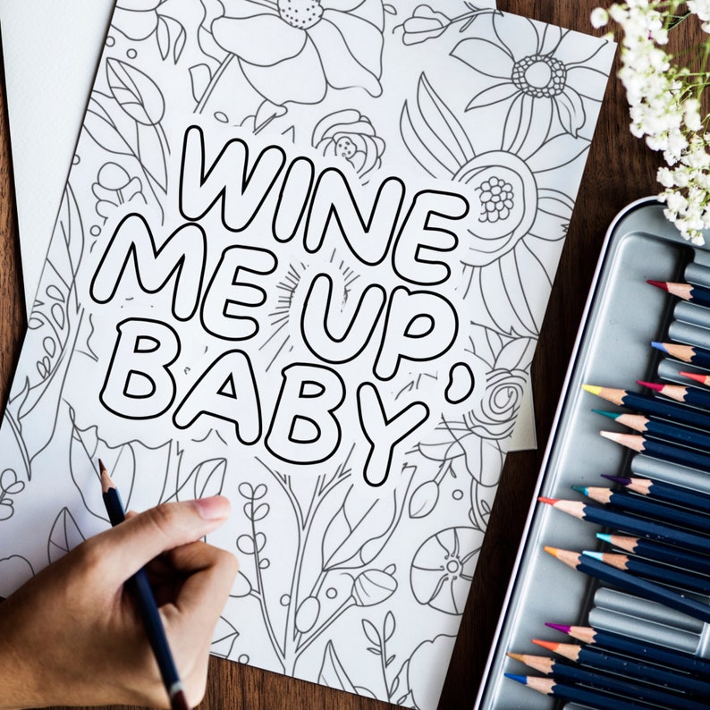 May include: A black and white coloring page with a floral design and the text "Wine Me Up, Baby".