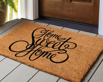 Home Sweet Home Welcome Mat At Custom Front Door of House., Stock image