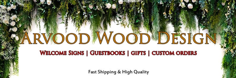 Puede incluir: Un banner con el texto "ARVOOD WOOD DESIGN" en letras doradas. Debajo, en rojo, las palabras "WELCOME SIGNS | GUESTBOOKS | GIFTS | CUSTOM ORDERS". El banner est&aacute; enmarcado por follaje verde y flores blancas.