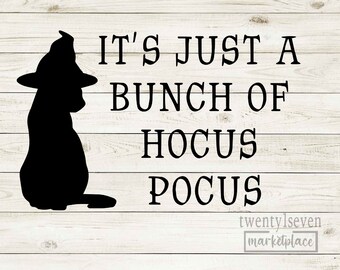 May include: Black silhouette of a cat wearing a witch's hat with the text "It's just a bunch of Hocus Pocus" on a white wood background.