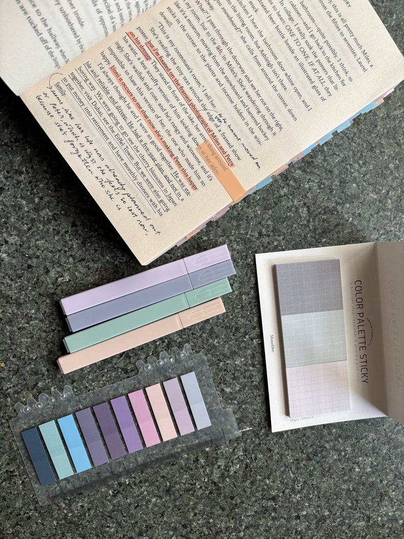 May include: A set of colorful sticky notes with a grid pattern. The notes are arranged in a color palette, with shades of blue, purple, pink, and green. The notes are labeled "Color Palette Sticky" and "A miniature set of colorful sticky notes".