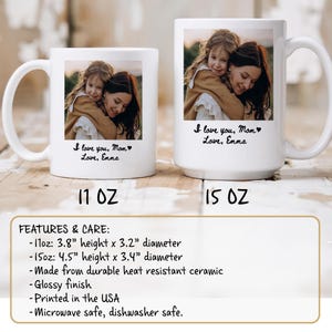 May include: Two white ceramic mugs featuring a photograph of a mother and child embracing. The mugs are printed with the text "I love you, Mom, Love, Emma". The 11 oz mug is 9.6 cm high and 8.1 cm in diameter, and the 15 oz mug is 11.4 cm high and 8.6 cm in diameter.