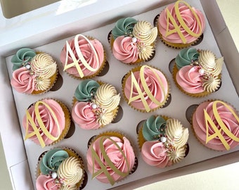 May include: A dozen pink and green cupcakes decorated with gold glitter and the number "40" on top.