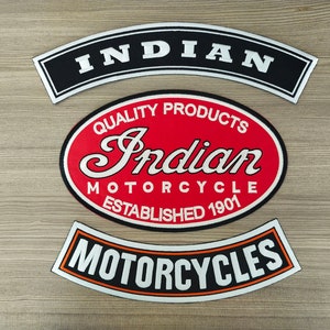 May include: Three embroidered patches for a motorcycle jacket. The top patch is black with white text that reads "INDIAN". The middle patch is red with white text that reads "Indian Motorcycle Established 1901" and "Quality Products". The bottom patch is black with orange trim and white text that reads "MOTORCYCLES".