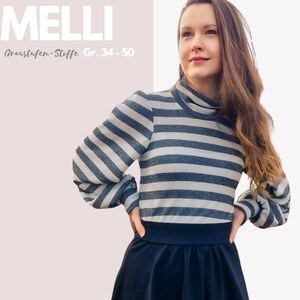Könnte beinhalten: Eine Frau trägt ein gestreiftes Langarmshirt mit Rollkragen und einen schwarzen Rock. Das Shirt hat weiße und graue Streifen. Der Text "MELLI Graustufen-Stoffe Gr. 34 - 50" ist in der oberen linken Ecke des Bildes sichtbar.