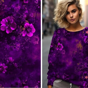 May include: A purple sweatshirt with a floral print featuring pink flowers and gold accents. The sweatshirt has a crew neck and long sleeves.