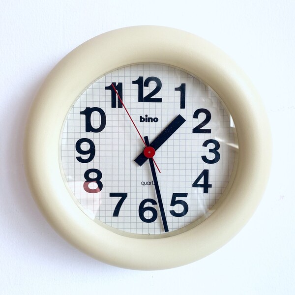Vintage Bino wall clock of Italian design in Memphis style from the 1980s