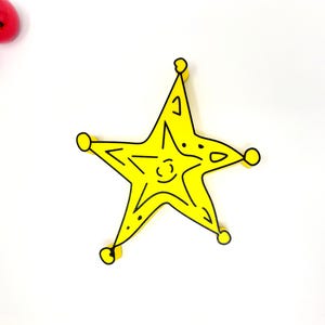 May include: A yellow five-pointed star with black outlines. The star has a simple, hand-drawn style.