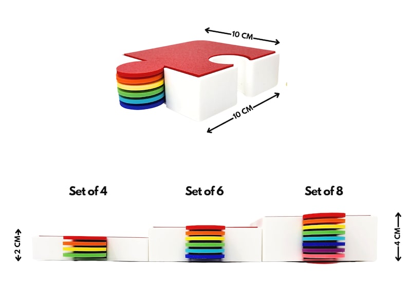 May include: Set of colorful puzzle-shaped coasters in red, orange, yellow, green, blue, indigo, and violet. The coasters are 10 cm wide and 4 cm high.