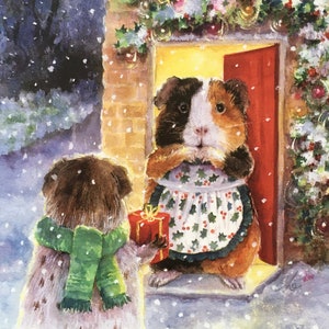 El Visitante. Un conejillo de indias que entrega su regalo de Navidad sorprende a su amiga en la puerta de su casa en una tarde nevada.