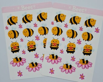 May include: Two identical sticker sheets featuring the text "Bees" at the top. Each sheet displays various cartoon bees in yellow and black, some holding red hearts and others sleeping on pink flowers, interspersed with small pink flower icons.