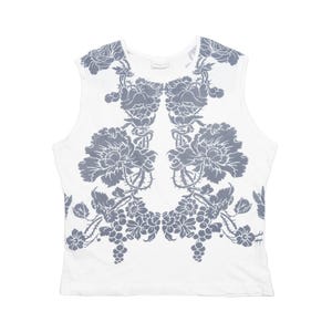 May include: White sleeveless top with a large gray floral design. The graphic features detailed flowers, leaves, and grape-like clusters, creating a symmetrical pattern across the front. The top has a scoop neck.