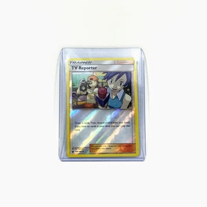May include: A Pokemon trading card featuring a Trainer card called "TV Reporter". The card shows a woman with purple hair holding a microphone and a man with a camera. The card text reads "Draw 3 cards. Then, discard a card from your hand. If you have no cards in your deck, you can't play this card."