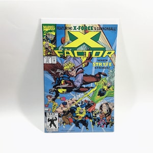 May include: A comic book cover featuring a group of superheroes in action. The cover is blue and green with the title "X-Factor" and the text "When Stryfe Strikes!" The cover also features the text "Marvel Comics" and "Featuring X-Force's Cannonball!"