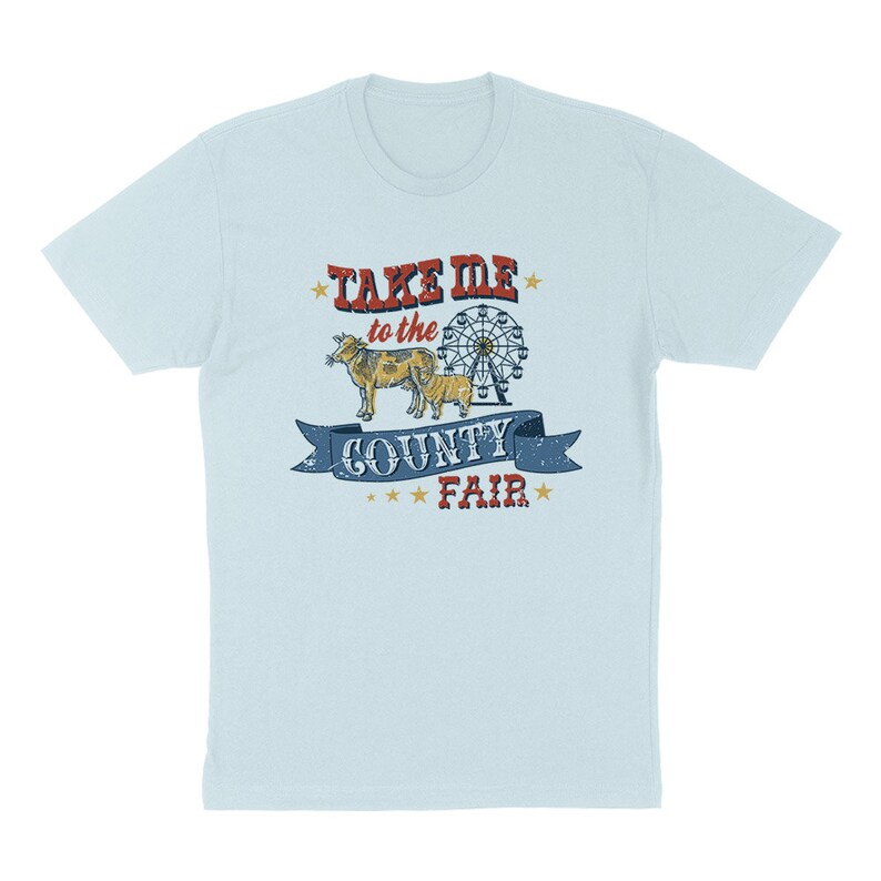 May include: Light blue t-shirt with a distressed graphic. The graphic features the text "TAKE ME to the COUNTY FAIR" in red and blue, along with illustrations of a cow, calf, and a Ferris wheel. The design has a vintage, worn look.