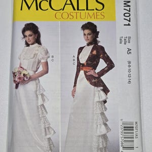 May include: McCall's Costumes sewing pattern M7071. The pattern features two women's costume designs. One design includes a white dress with ruffles and a floral bouquet. The other design includes a jacket with a floral pattern and a white skirt.