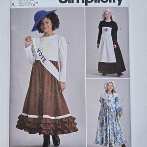 May include: Simplicity sewing pattern S9352 for children's costumes in sizes 7-14. The envelope displays three outfits: a suffragette costume with a VOTE sash, a nurse costume with a white apron and cap, and a long floral dress with a bonnet.