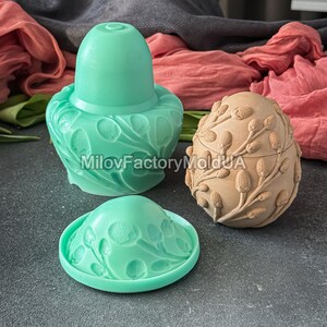 May include: Three decorative molds in the image. A light green mold with a floral design, a light brown egg-shaped mold with a floral design, and a light green mold with a floral design. The text "MilovFactoryMoldUA" is visible.