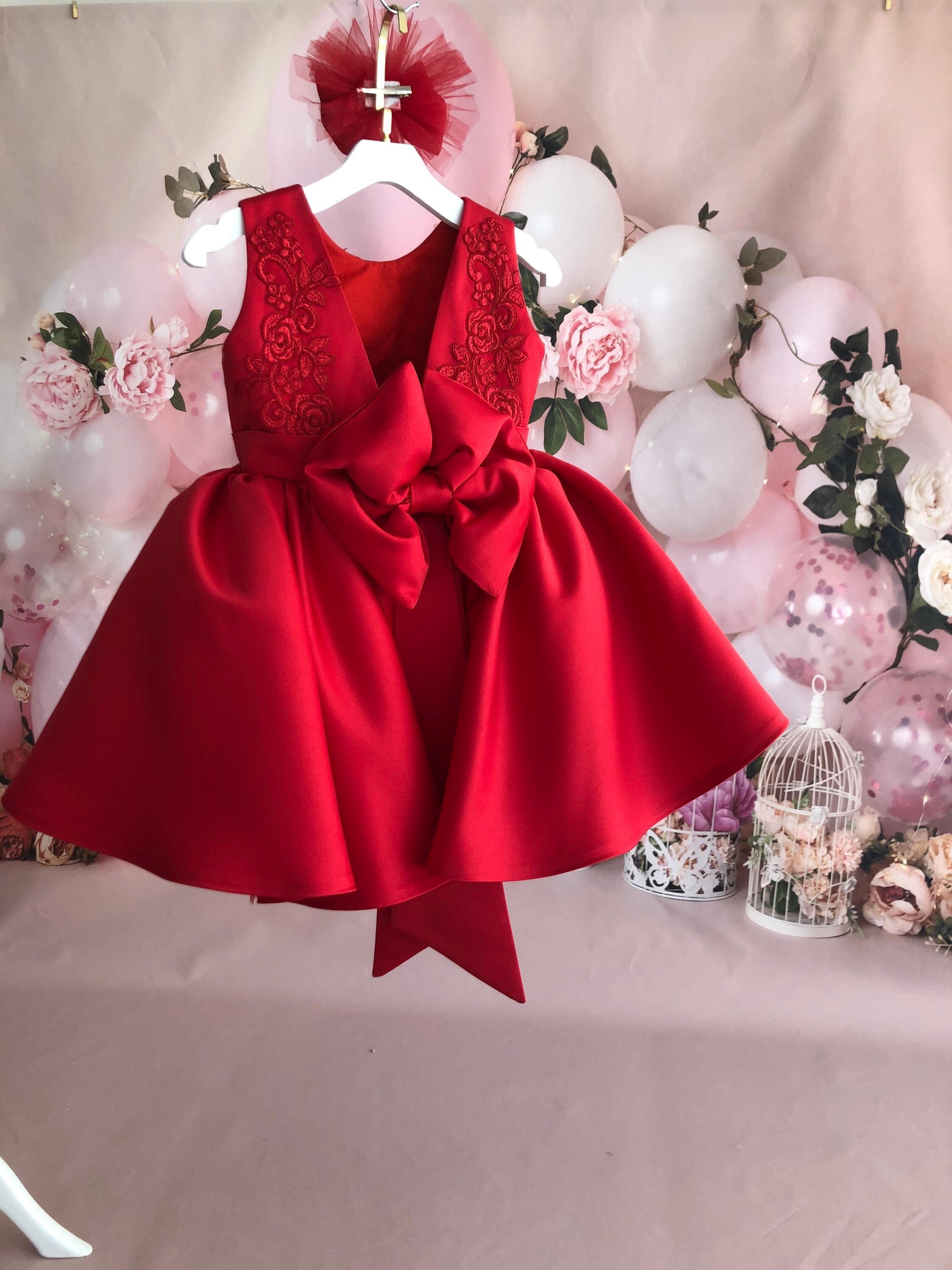 red newborn gown
