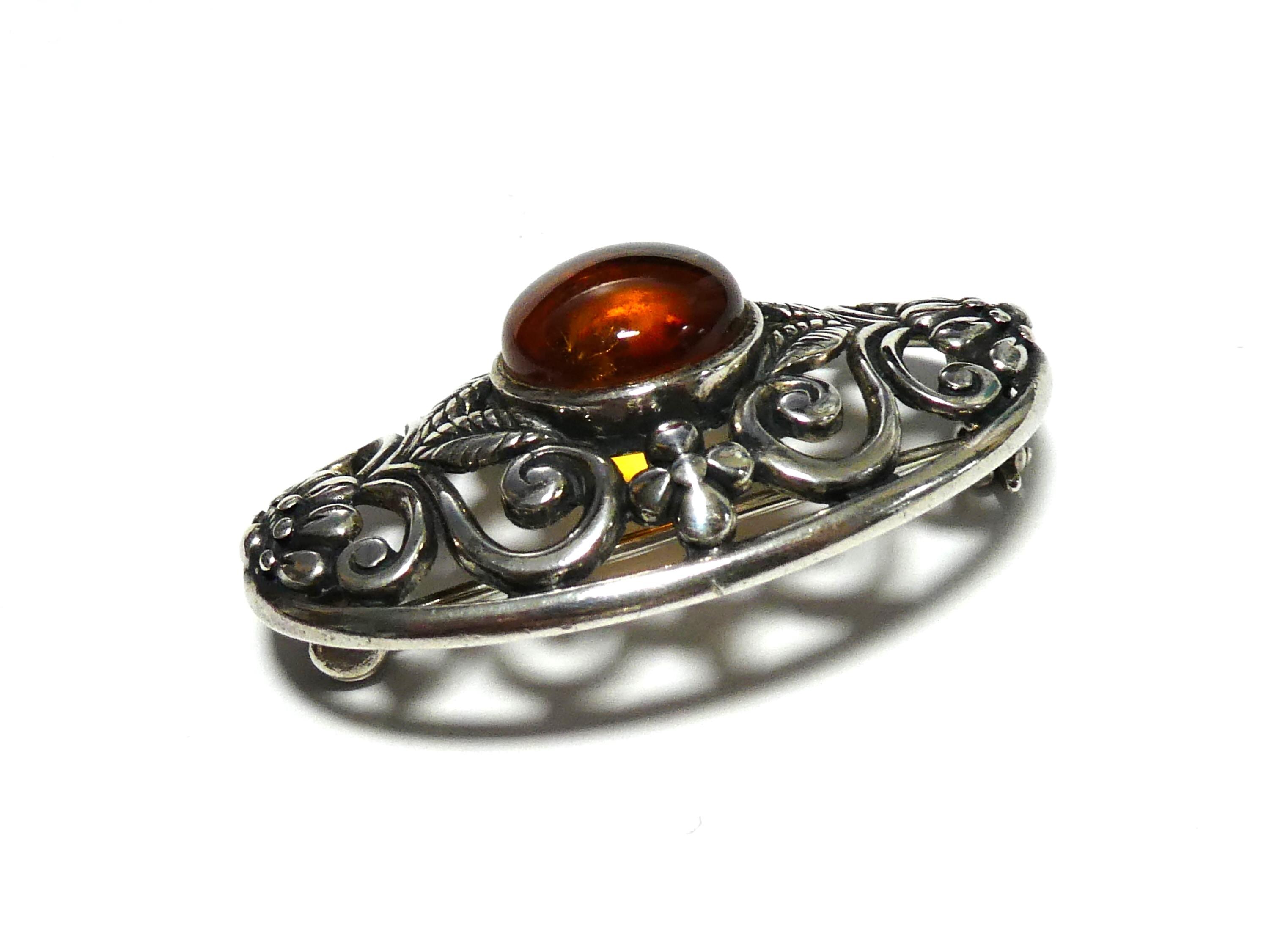 Bague en argent torsadé et cabochon en ambre miel