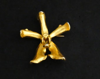 Broche/colgante de flor de orquídea real chapado en oro suizo de 24 quilates de Risis Singapur de 1980