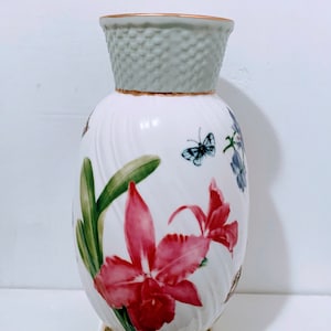 Hand painted Orchid Medley Pottery vase Burton & Burton  orchids, Iris, chrysanthemum flowers on vase with gold trim 7 1/2” T x 4 1/2” W