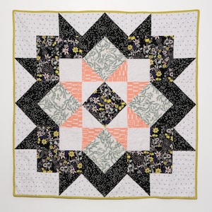 Black, white and floral starry baby or lap quilt