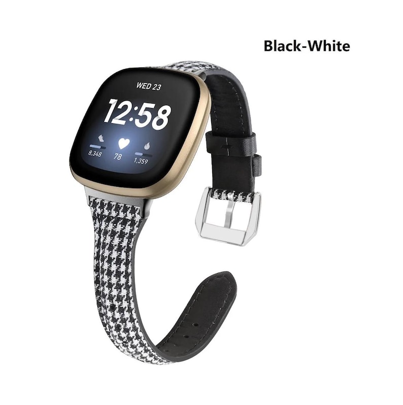 May include: A black and white patterned watch band with a black leather strap and a silver buckle. The watch face displays the time as 12:58 and the day as Wed 23. The band is labeled "Black-White".