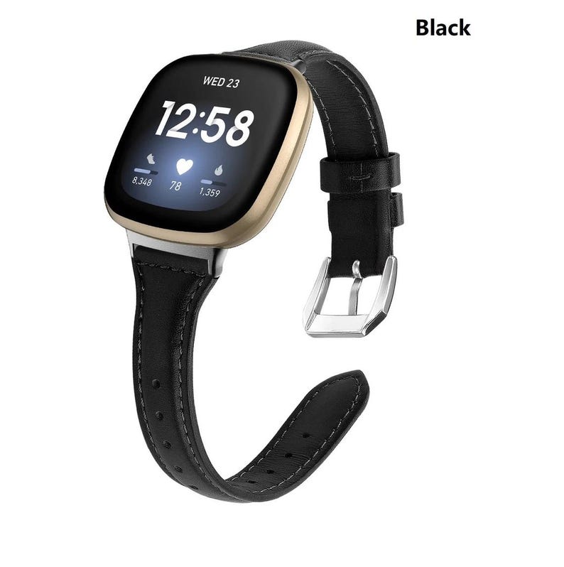 May include: Black leather watch band with a silver buckle, compatible with the Fitbit Sense and Versa 3 smartwatches. The band has a stitched design and a classic look.