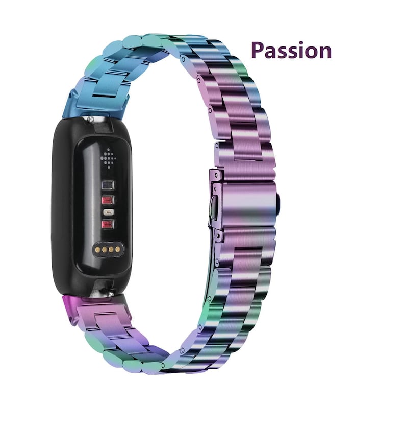 May include: A black fitness tracker with a multi-colored, rainbow-hued metal band. The band is made of linked metal pieces and has a clasp closure. The word "Passion" is written in a dark purple font.