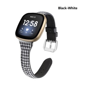 May include: A black and white patterned watch band with a black leather strap and a silver buckle. The watch face is gold and displays the time as 12:58. The text "WED 23" is displayed above the time. The watch band is labeled "Black-White".