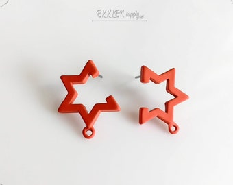 May include: Two orange star-shaped earrings with a post and a small loop at the bottom. The earrings are set against a white background. The text "EKKLEN supply" is in the upper right corner.
