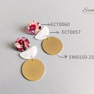 May include: Earrings with a gold disc, a white half-circle, and a round stud with red, white, and brown marbling. The earrings are labeled with the text "ECT0060", "ECT0057", and "EM0150-25". The word "Sample" is also visible.