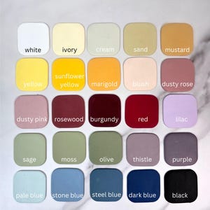 May include: A grid of twenty-five square colour swatches with rounded corners, each labelled with its corresponding colour name: white, ivory, cream, sand, mustard, yellow, sunflower yellow, marigold, blush, dusty rose, dusty pink, rosewood, burgundy, red, lilac, sage, moss, olive, thistle, purple, pale blue, stone blue, steel blue, dark blue, and black.