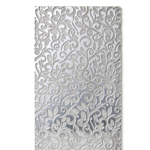 May include: A silver metal sheet with an embossed floral pattern. The pattern is intricate and detailed, with swirls and leaves.