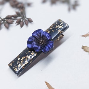 Black & gold hair clip with purple flower. Handmade floral hair accessory. Black resin with gold eco flakes on a gold clip. Small gift.