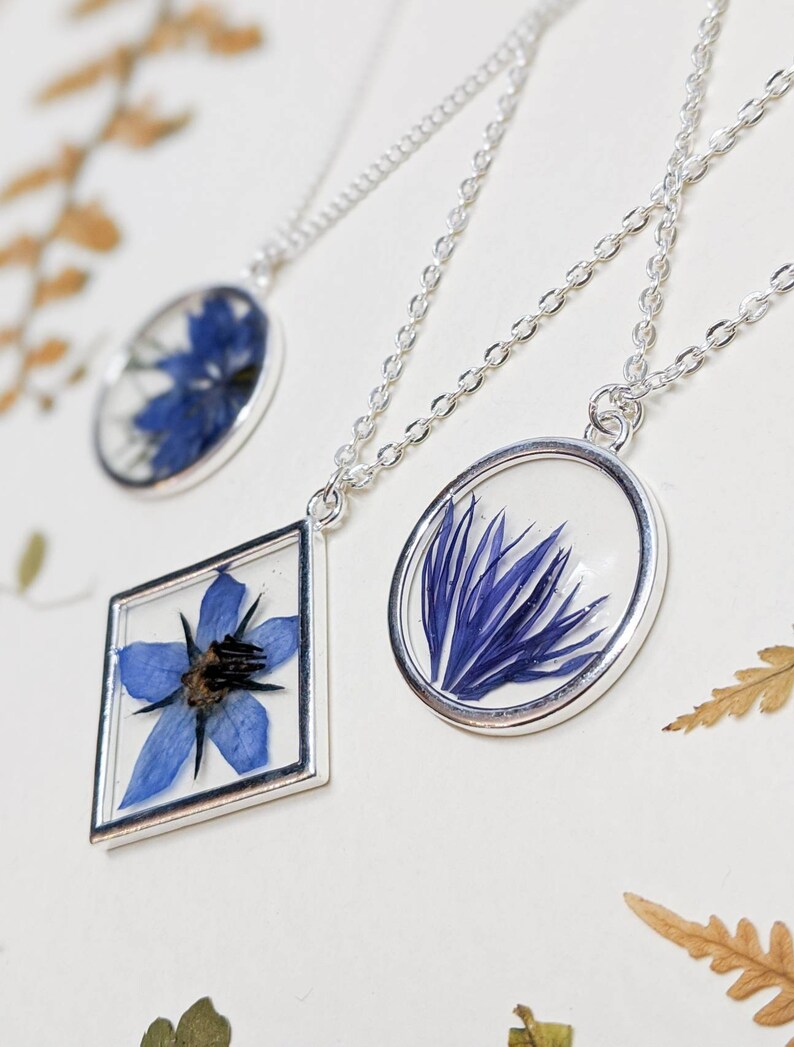 Handmade Blue flowers Floral gift Real pressed blue petals in gold circle pendant with chain Resin Pressed flower Cornflower necklace