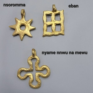 May include: Three gold pendants with different designs. The first pendant is a star with a circle in the center. The second pendant is a square with four squares inside. The third pendant is a four-leaf clover.