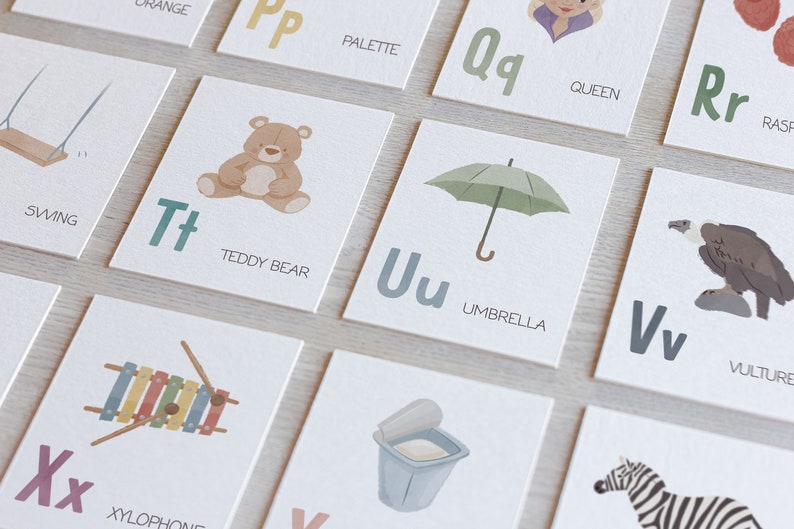 May include: A set of alphabet flash cards with illustrations and the letter name. The cards feature a swing, teddy bear, umbrella, vulture, xylophone, and more.