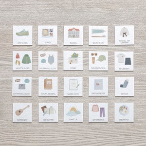 May include: A set of 20 illustrated cards with various school-related items, including gym shoes, lunch, school, brush teeth, martial arts uniform, jacket and shoes, swimming outfit, money, sun protection, PE uniform, swimming outfit, school reading, signed form, speech folder, inhaler, instrument, homework, wake up, get dressed, and breakfast.