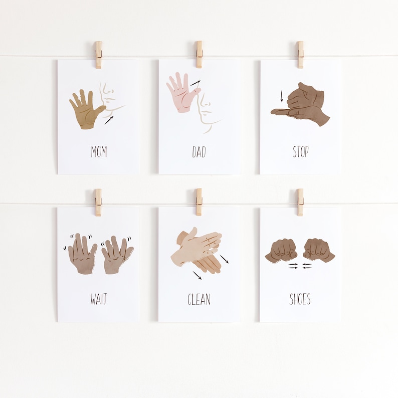 May include: Six white cards with illustrations of American Sign Language signs. The signs are for the words "Mom", "Dad", "Stop", "Wait", "Clean", and "Shoes".