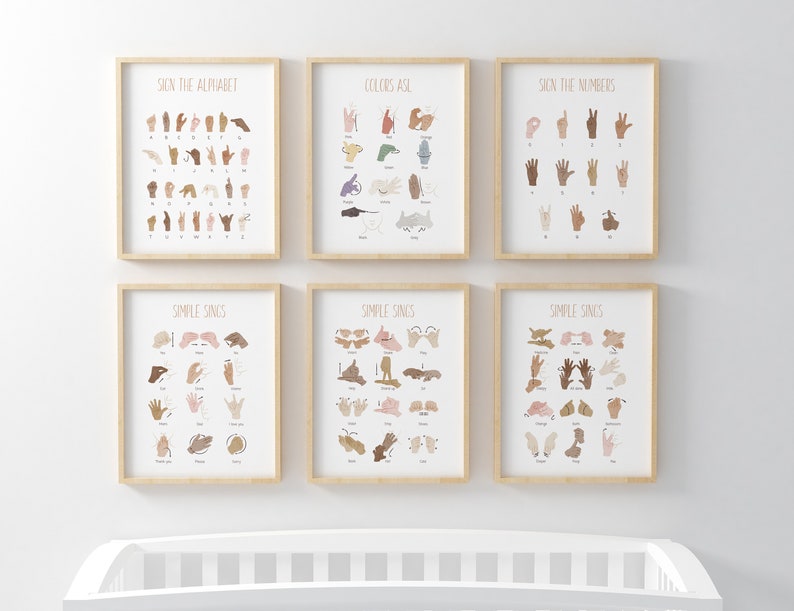 May include: Six framed prints with illustrations of sign language. The prints are arranged in two rows of three. The top row shows the alphabet, colors, and numbers in sign language. The bottom row shows simple signs for words like "please", "thank you", and "more".