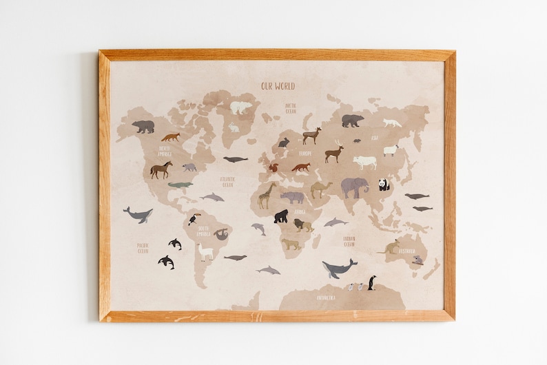 May include: A beige world map with a brown wooden frame. The map features various animals from different continents, including a polar bear, a giraffe, a kangaroo, and a penguin. The text "Our World" is printed at the top of the map.