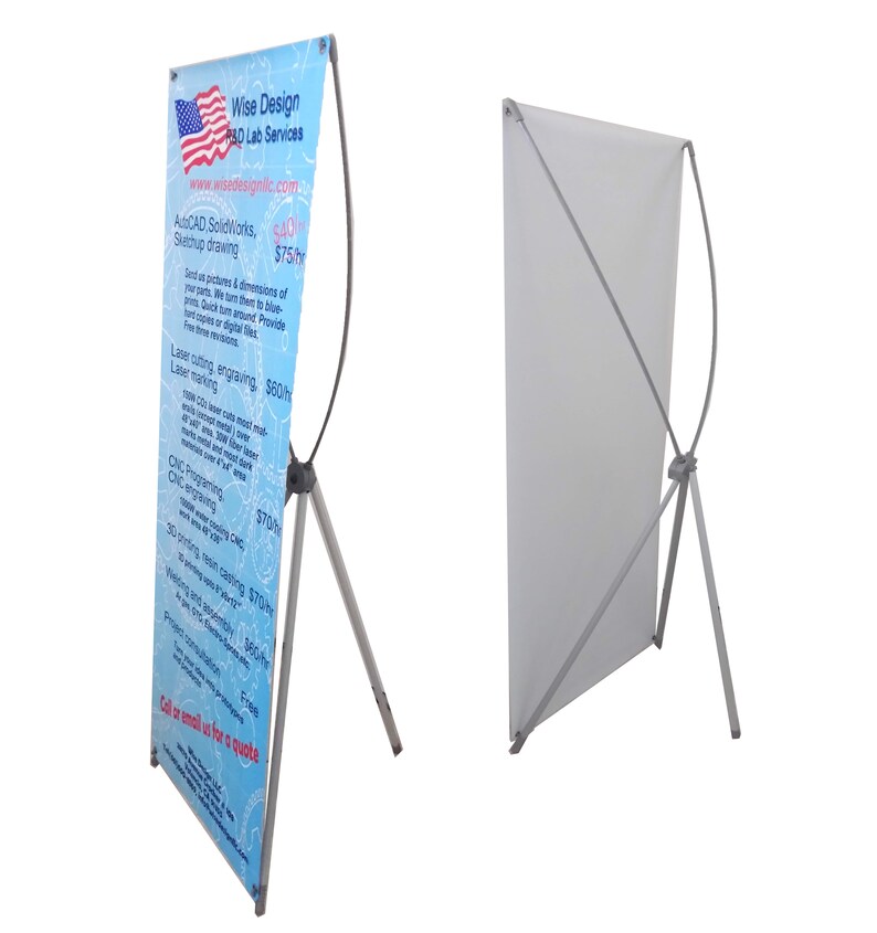 May include: A white retractable banner stand with a blue and white banner featuring the text "Wise Design R&D Lab Services" and a list of services offered. The banner stand is made of metal and has a tripod base.