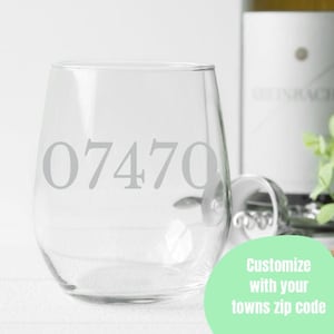 May include: A clear glass wine glass with the number 07470 etched on the side. Customize with your town's zip code.