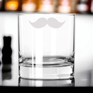 May include: A clear glass tumbler with a white mustache design etched on the front.