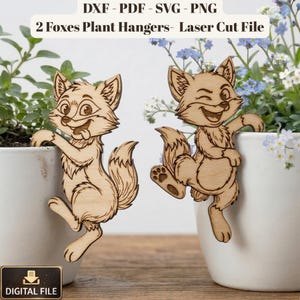 May include: A white ceramic mug with a black handle and the text "But First, Coffee" in a bold, black font. The mug is set against a neutral background, highlighting its simple design.